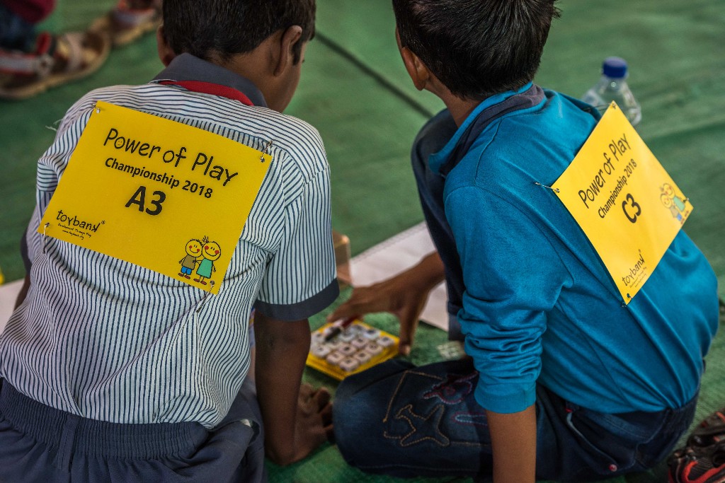 Two boys wearing Power of Play Championship 2018 competitor numbers