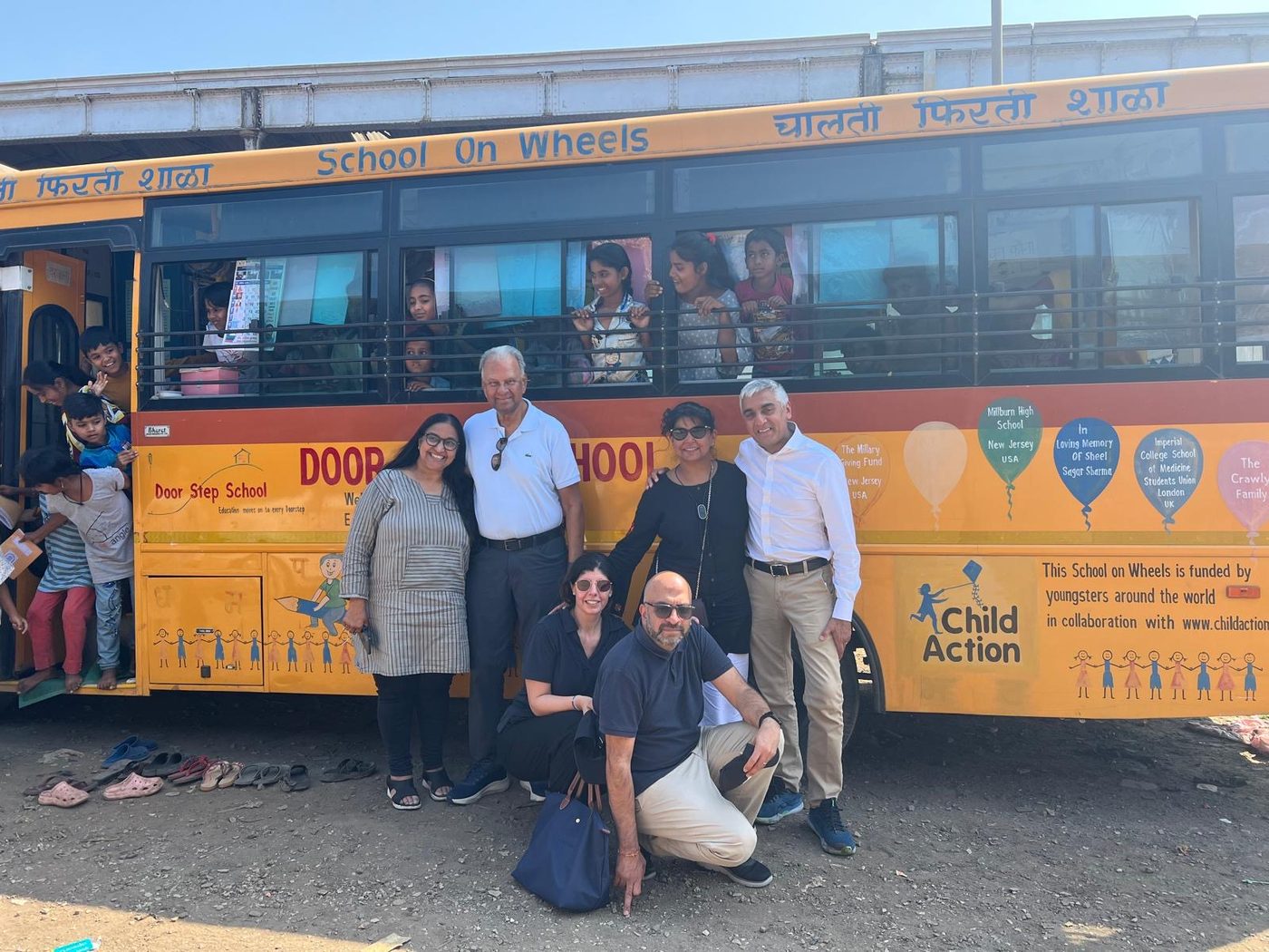 Doorstep School founder Bina Lashkari with Child Action supporters and children at a School on Wheels bus