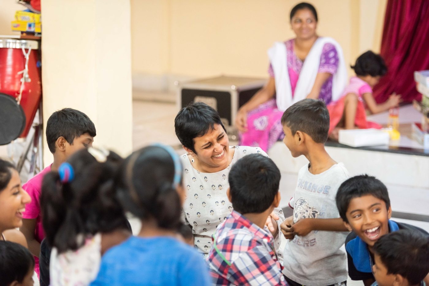 Opentree Foundation founder Shweta Chari laughing with children during a play session
